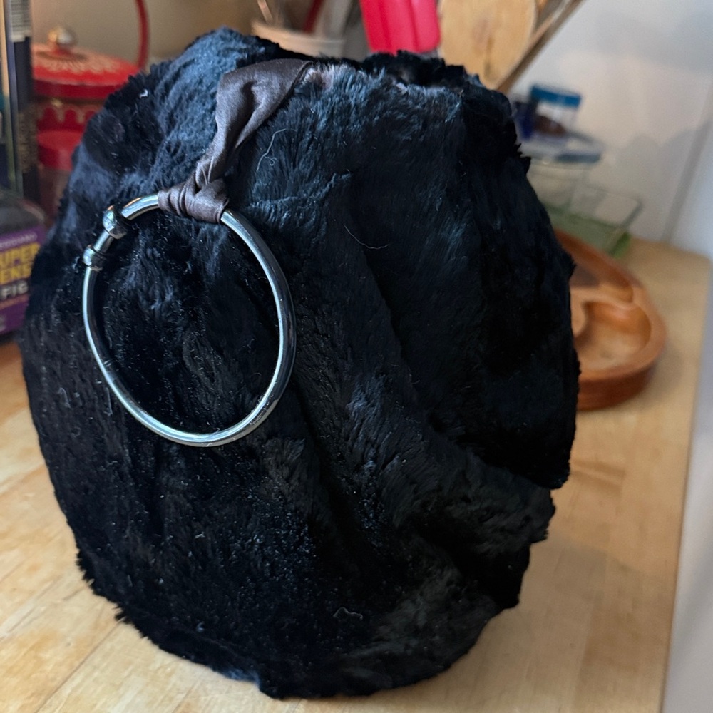 Hi Vintage Muff black seal or beaver fur excellent condition goose down padding.